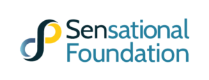Logo.  An lemniscape or infinity symbol to the right of the words Sensational Foundation in the colors blue, yellow, & black, with the black creating a shape of an "S". To the left the word Sensational in blue lettering with the "Sen" specifically in black.  The word Foundation in blue lettering below. All form the Sensational Foundation Logo.