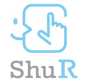 Face and hand-symbol in light blue, below the the letters Shu in grey, and the letter R in light blue.